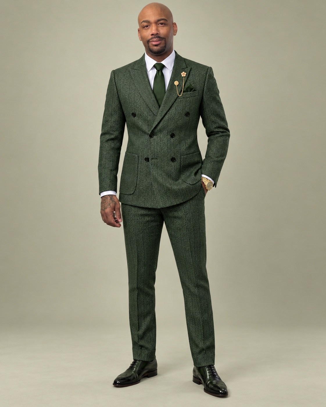 Brennden D. Colbert in a green tailored suit
